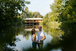 man and woman by lake