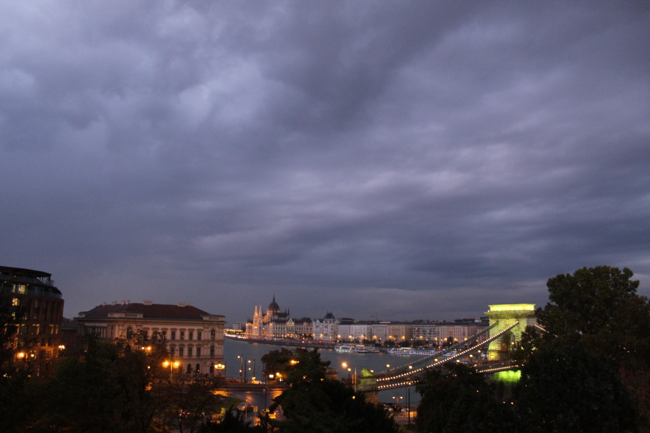 photo of Budapest in the dark with light bridge